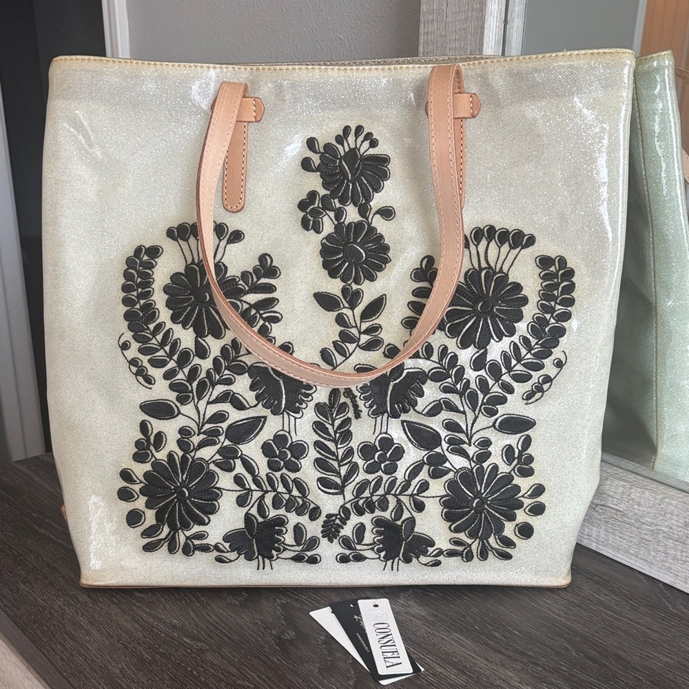 Consuela Shimmering Cream Tote with Black Floral Design